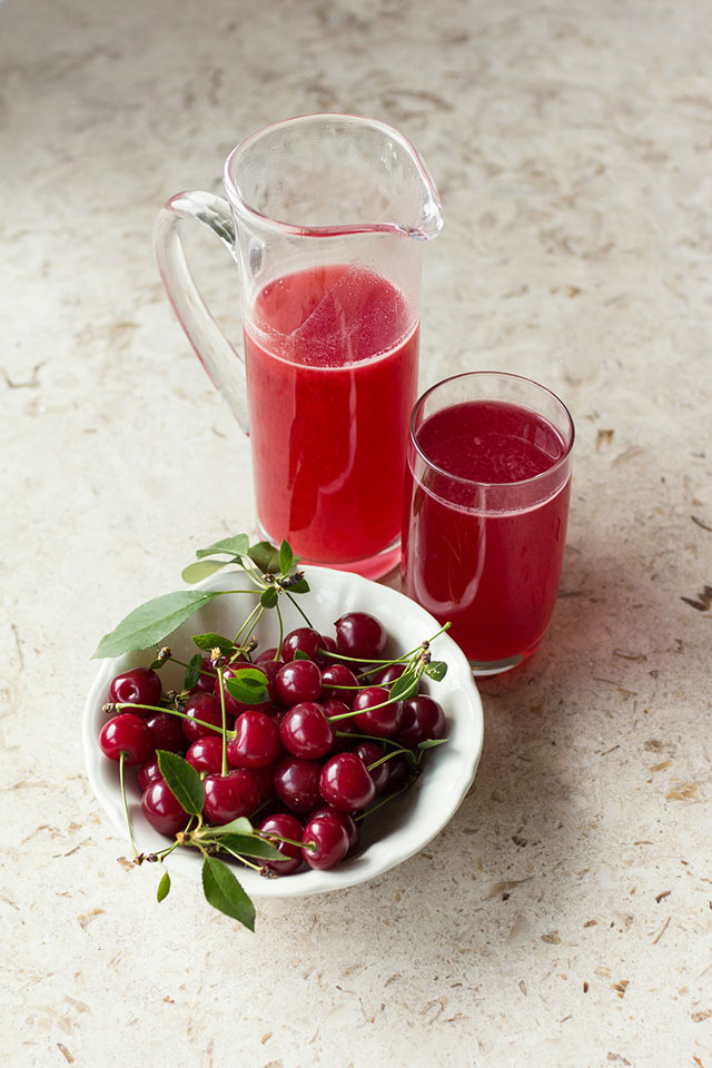 Homemade cherry juice with fresh sour cherries